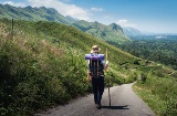 Pilgrim walking among mountains