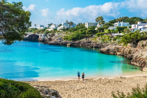 Tourists at Cala Esmeralda, located in Cala d’Or in Mallorca, Balearic Islands