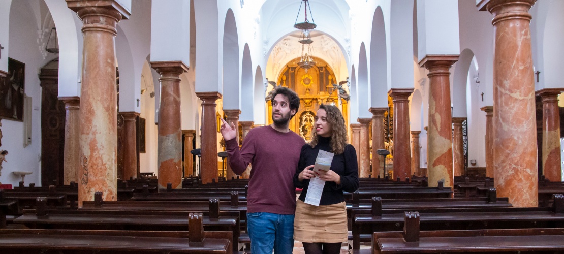 Tourists visiting the church of Asunción y Ángeles de Cabra in Córdoba, Andalusia