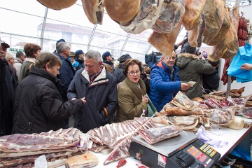 Stall selling meat products in the main marquee during the Feira do Cocido in Lalín (Pontevedra, Galicia)