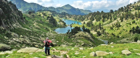 Hiker viewing the scenery in Aigüestortes National Park, Lleida.