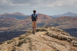 Tourist in the nature reserve of the volcanoes in Lanzarote, Canary Islands