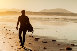 Surfer in Lanzarote at sunset